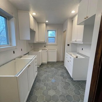 Otto Custom Builders - Installing kitchen cabinets and renovating the kitchen and finishing with paint. - Handyman Near Me