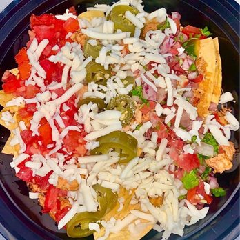 Boss Burrito - a plate of nachos with cheese and peppers - Mexican Near Me - Paducah, Kentucky Boss Burrito - a plate of nachos with cheese and peppers - Mexican Near Me - Paducah, Kentucky