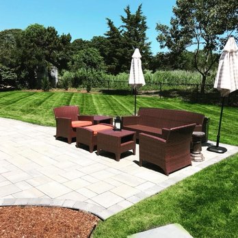 CMEthier Associates, Inc. - a patio with chairs and umbrellas - Landscaping Near Me CMEthier Associates, Inc. - a patio with chairs and umbrellas - Landscaping Near Me