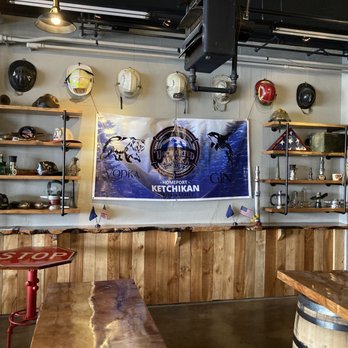 Uncharted Alaska Distillery - a bar with a wooden table - Distilleries Near Me - Ketchikan, Alaska Uncharted Alaska Distillery - a bar with a wooden table - Distilleries Near Me - Ketchikan, Alaska