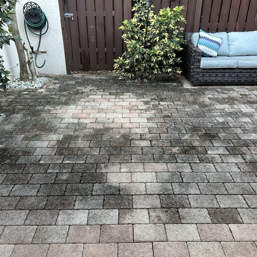 Before, dark stains on brick pavers