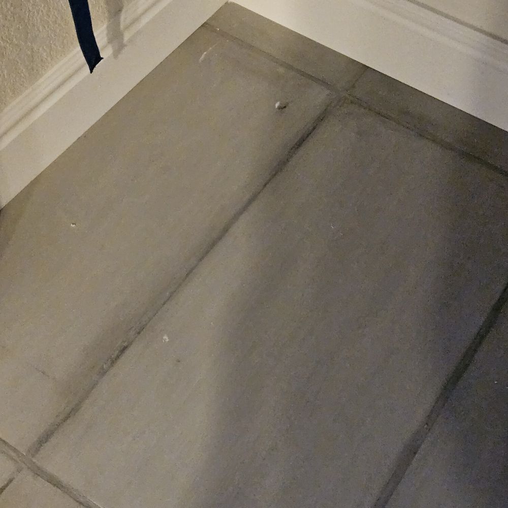 Anatom Restoration - This is BRAND NEW GROUT AND TILE.  What a mess!  Looks 20 years old and moldy. - Damage Restoration Near Me - Centennial, Colorado