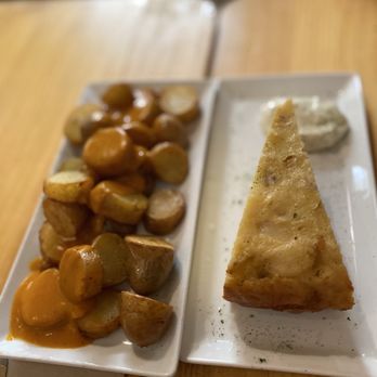 El Sur - Patatas Bravas and potato torta - Tapas Bars Near Me - Madrid, M El Sur - Patatas Bravas and potato torta - Tapas Bars Near Me - Madrid, M