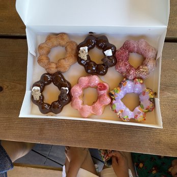 Mochinut - Seattle - Left to right, top to bottom: Churro, s'mores, yogurt parfait, s'mores, strawberry, taro with fruity pebbles - Donuts Near Me - Seattle, Washington