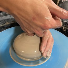Making a masterpiece at the pottery wheel!