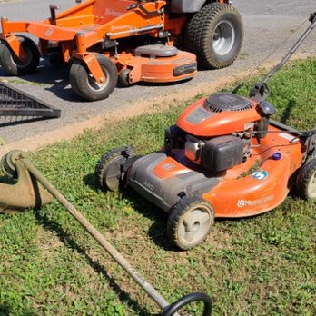 Blades Lawn Care - two lawn mowers and a lawn mower - Lawn Services Near Me