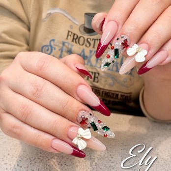 Ely Nails & Spa - Deep red French tips with sparkling crystals and elegant 3D bows--a luxurious custom set from Ely Nails & Spa. - Nail Salons Near Me - Sevierville, Tennessee Ely Nails & Spa - Deep red French tips with sparkling crystals and elegant 3D bows--a luxurious custom set from Ely Nails & Spa. - Nail Salons Near Me - Sevierville, Tennessee