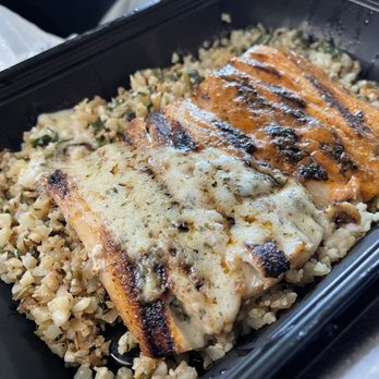 California Fish Grill - Mahi Mahi in a bed of cauliflower rice. Second side was kalesla. They serve it in a separate container to maintain its cool temperature. - Seafood Near Me - Brea, California California Fish Grill - Mahi Mahi in a bed of cauliflower rice. Second side was kalesla. They serve it in a separate container to maintain its cool temperature. - Seafood Near Me - Brea, California