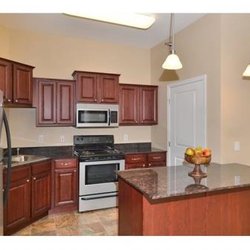 Waterford Commons - kitchen with a center island and a stove top oven