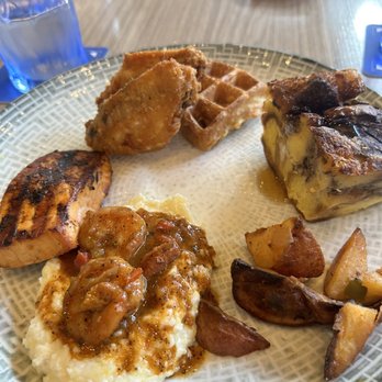 Spurrier's Gridiron Grille - Brunch- chicken and waffle, banana foster French toast, shrimp and grits , salmon. - American Near Me - Gainesville, Florida Spurrier's Gridiron Grille - Brunch- chicken and waffle, banana foster French toast, shrimp and grits , salmon. - American Near Me - Gainesville, Florida