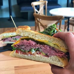 Vintage Wine + Eats - The Roast Beef with cheddar, housemade pickles, lettuce, tomato, and rosemary aioli.