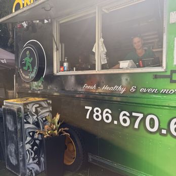 On The Run Vegan - Ali on the grill, takes care of every order with warm attention. - Vegan Near Me - Miami, Florida