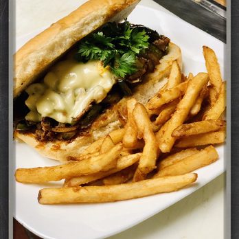 Touchdown Sports Bar - a steak sandwich and french fries - Sports Bars Near Me - Moultrie, Georgia Touchdown Sports Bar - a steak sandwich and french fries - Sports Bars Near Me - Moultrie, Georgia