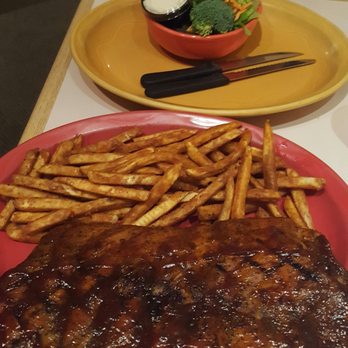 Rustler's Restaurant - Full rack of ribs, seasoned fries and salad - American Near Me - Tropic, Utah