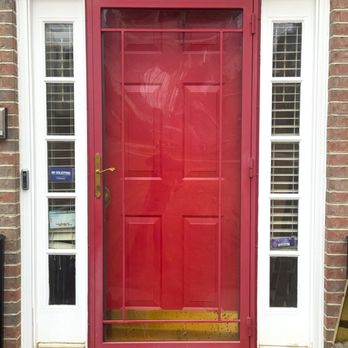 Medallion - Red entry and security door with a side light and toe kick. - Windows Installation Near Me - Forestville, Maryland Medallion - Red entry and security door with a side light and toe kick. - Windows Installation Near Me - Forestville, Maryland