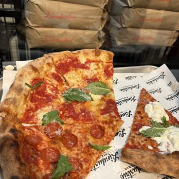 L’industrie Pizzeria - margherita pizza slices and New Yorker pizza in the box - Pizza Near Me - New York, New York L’industrie Pizzeria - margherita pizza slices and New Yorker pizza in the box - Pizza Near Me - New York, New York
