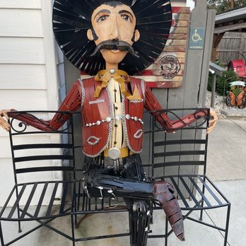 Badger Bobs - a statue of a man sitting on a bench - Bars Near Me - Delavan, Wisconsin