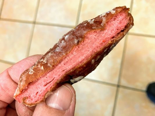 Photo of Kamehameha Bakery - Honolulu, HI, United States. Mid section of the strawberry glazed donut
