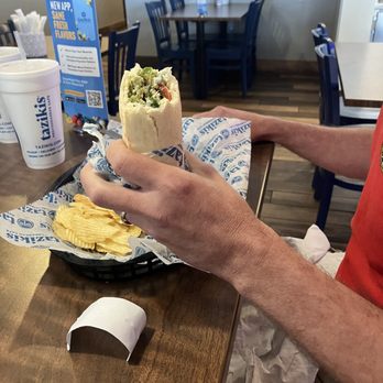Taziki's Mediterranean Cafe - Mr R's Falafel Gyro came with chips and his choice of side. 02AUG26 - Greek Near Me - San Marcos, Texas Taziki's Mediterranean Cafe - Mr R's Falafel Gyro came with chips and his choice of side. 02AUG26 - Greek Near Me - San Marcos, Texas