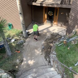 T&T Property Maintenance - Compacting base material for a flagstone walkway