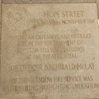 Theatre Royal - The Fire Service plaque in Hope Street recording the fire in the building that resulted in the death of Archie McLay. - Performing Arts Near Me - Glasgow, GLG
