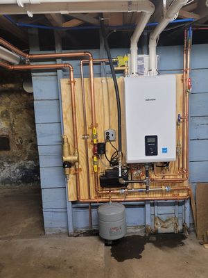 new High efficiency combi boiler - Removed old eighty percent cast iron boiler that was leaking, causing issues for homeowner. installing this new high efficiency boiler with Tank less water heater built into, take care of all customers' needs for heating and domestic hot water use. new High efficiency combi boiler - Removed old eighty percent cast iron boiler that was leaking, causing issues for homeowner. installing this new high efficiency boiler with Tank less water heater built into, take care of all customers' needs for heating and domestic hot water use.
