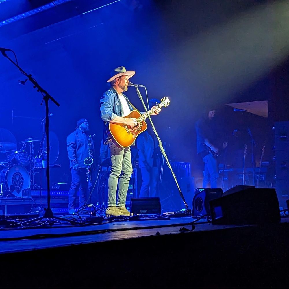 Kiva Auditorium - a man in a cowboy hat playing a guitar - Music Venues Near Me - Albuquerque, New Mexico