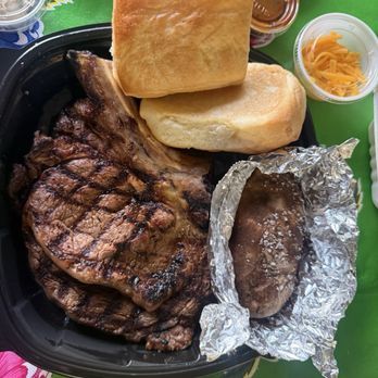 Texas Roadhouse - Bone in mesium rare ribeye with loaded potato and fresh  baked addictive break (there must be crack in there or something) $44 - Steakhouses Near Me - National City, California