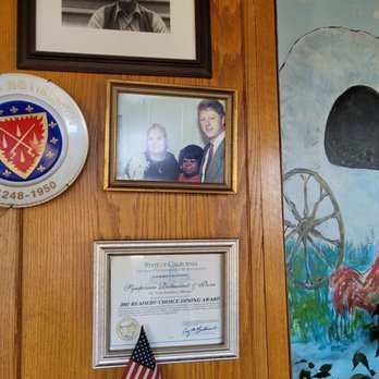 Symposium Restaurant & Pizza House - a man and a woman - Pizza Near Me - Davis, California