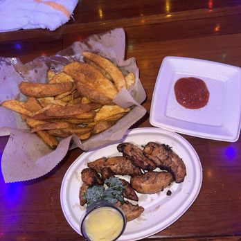Seacrets - Jerk chicken and fries - Bars Near Me - Ocean City, Maryland