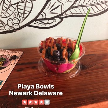 Playa Bowls - Half Kale/Half Pitaya base, topped with strawberries, bananas, and blueberries, drizzled with almond butter. - Acai Bowls Near Me - Newark, Delaware Playa Bowls - Half Kale/Half Pitaya base, topped with strawberries, bananas, and blueberries, drizzled with almond butter. - Acai Bowls Near Me - Newark, Delaware
