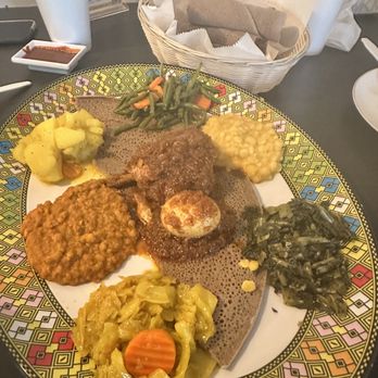 Abugida Ethiopian Cafe & Restaurant - Abugida Feast with chicken - Ethiopian Near Me - Charlotte, North Carolina Abugida Ethiopian Cafe & Restaurant - Abugida Feast with chicken - Ethiopian Near Me - Charlotte, North Carolina