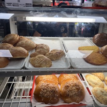 El Punto - a variety of baked goods in a display case - Colombian Near Me - Queens, New York