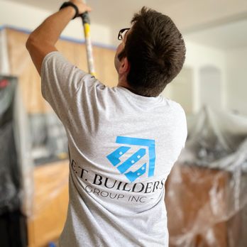 ET Builders Group - a man painting a ceiling - General Contractors Near Me ET Builders Group - a man painting a ceiling - General Contractors Near Me