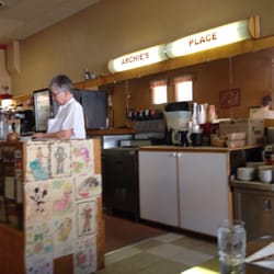 Archie's Place - Cool original sign. Archie (owner) at register.