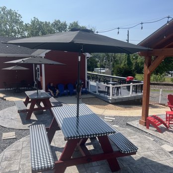 Asian Station - Plenty of outdoor seating, covered and uncovered with umbrellas! Bar tops and benches - Asian Fusion Near Me - Luray, Virginia