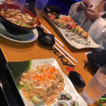 Tokyo 101 - a woman eating sushi at a restaurant - Japanese Near Me - Wilmington, North Carolina Tokyo 101 - a woman eating sushi at a restaurant - Japanese Near Me - Wilmington, North Carolina
