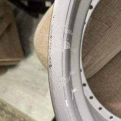 Legacy Rim Repair - One of the messed up wheels from throwing it on cement shop floor