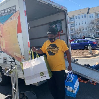 Let's Go Pro Movers - Team member getting the last few items off the truck. - Movers Near Me