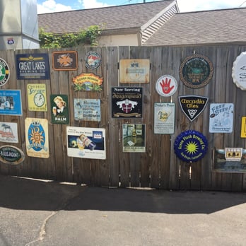 Graydon's  - The beer adorned wall at the entrance! :) - British Near Me - Grand Rapids, Michigan