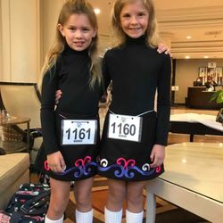 Rhythm of Ireland School of Irish Dance - Sisters Paige and Lily wearing their new Irish dance skirts.