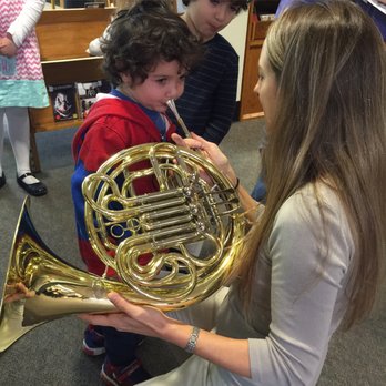 Iris Orchestra - Free Family Concerts and Instrument Petting Zoos allow children to try out all sorts of fun musical instruments. - Performing Arts Near Me - Germantown, Tennessee