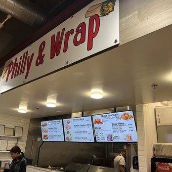 Philly & Wrap - a man standing in front of the counter - Wraps Near Me - Marietta, Georgia