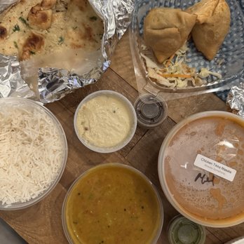 Masala Symphony - Garlic naan, veggie samosas, chicken tikka masala with rice, coconut chutney, sambar - Indian Near Me - Conshohocken, Pennsylvania Masala Symphony - Garlic naan, veggie samosas, chicken tikka masala with rice, coconut chutney, sambar - Indian Near Me - Conshohocken, Pennsylvania