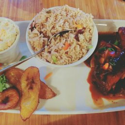 1/4 grilled jerk chicken, with rice and peas, plantains and coleslaw.
