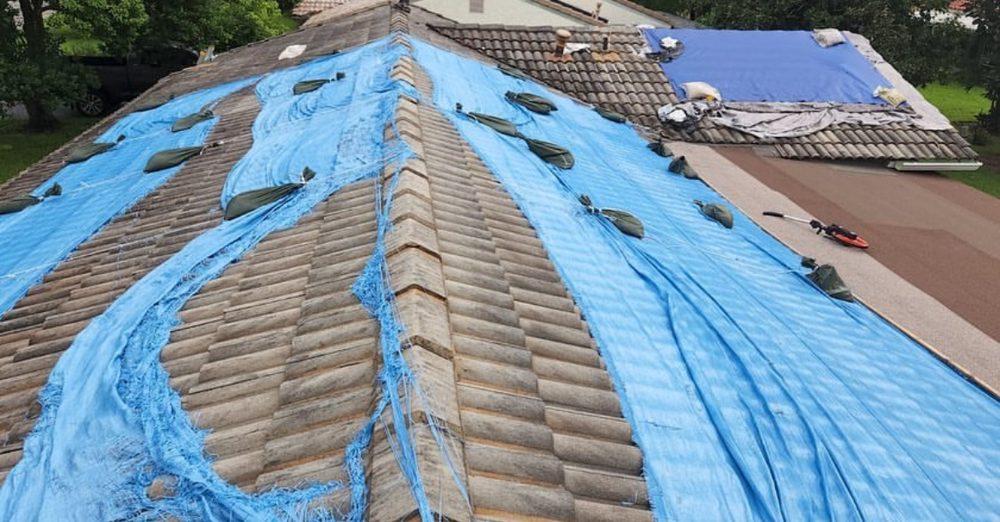 Slide of 305 Roof Tarps