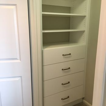 Classy Closets - Small walk in closet with his and hers symmetrical sides - Interior Design Near Me - San Marcos, California