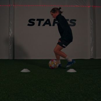 Joga Soccer Academy - youth soccer player dribbling at joga soccer academy indoor facility in bellingham, wa - Soccer Near Me - Bellingham, Washington Joga Soccer Academy - youth soccer player dribbling at joga soccer academy indoor facility in bellingham, wa - Soccer Near Me - Bellingham, Washington
