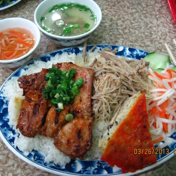 Com Tam Ninh Kieu - Broken rice with shredded pork, chicken and baked egg. On the top left corner are the fish sauce (left) and starter soup (right) - Vietnamese Near Me - Rosemead, California Com Tam Ninh Kieu - Broken rice with shredded pork, chicken and baked egg. On the top left corner are the fish sauce (left) and starter soup (right) - Vietnamese Near Me - Rosemead, California