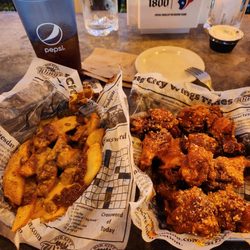 Big City Wings - Hot wings with chili cheese potato wedges.